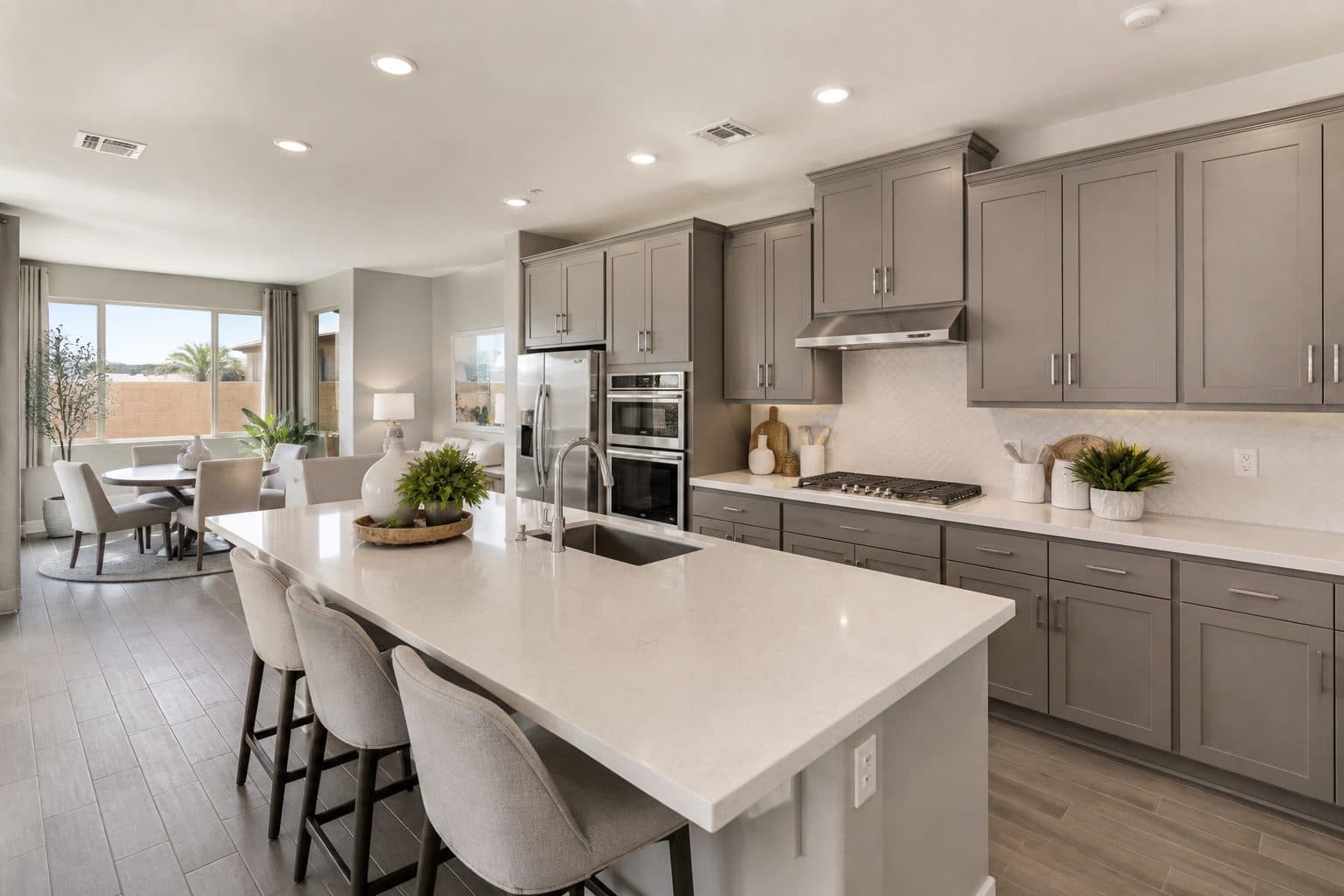 Open-concept kitchen with quartz island in a Henderson townhome